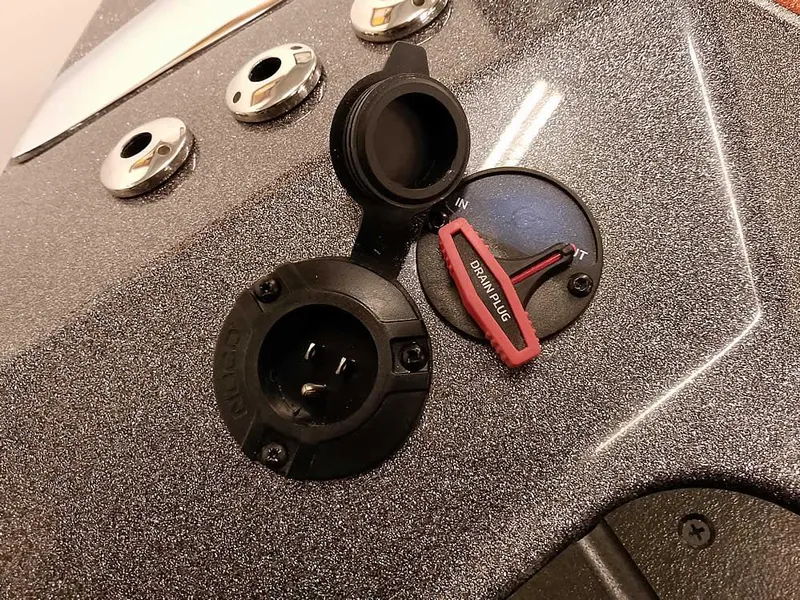 Slide: The Image of Control panel of 2025 Ranger Z520 SC boat with switches and connectors. - 38