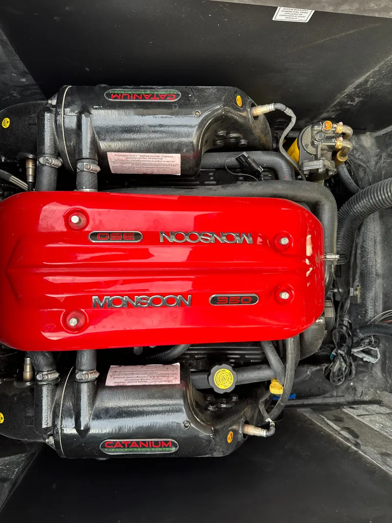 Slide: The Image of 2016 Axis Boats T22 Monsoon 350 engine with red cover and Catanium components. - 13