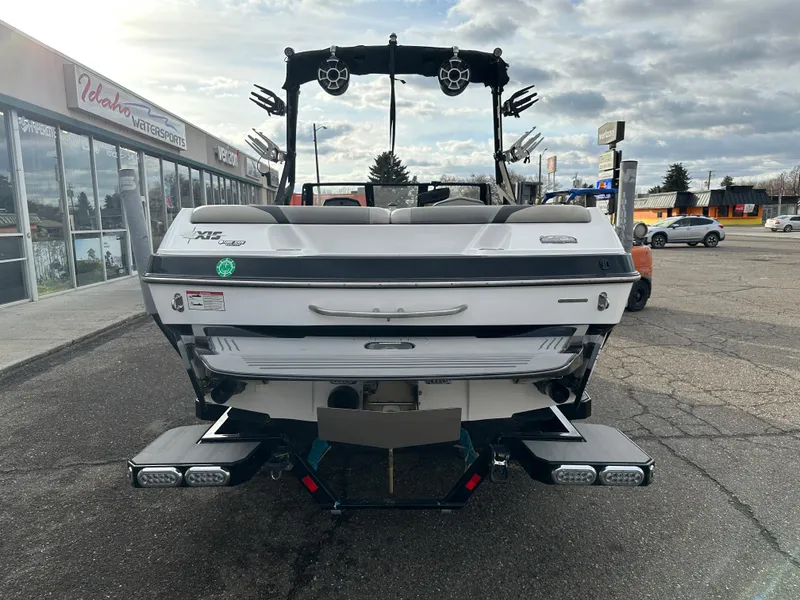 Slide: The Image of 2016 Axis Boats T22 at Idaho Watersports dealership, rear view. - 5
