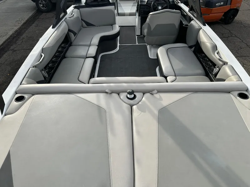 Slide: The Image of 2016 Axis Boats T22 interior with gray seating and cup holders. - 9