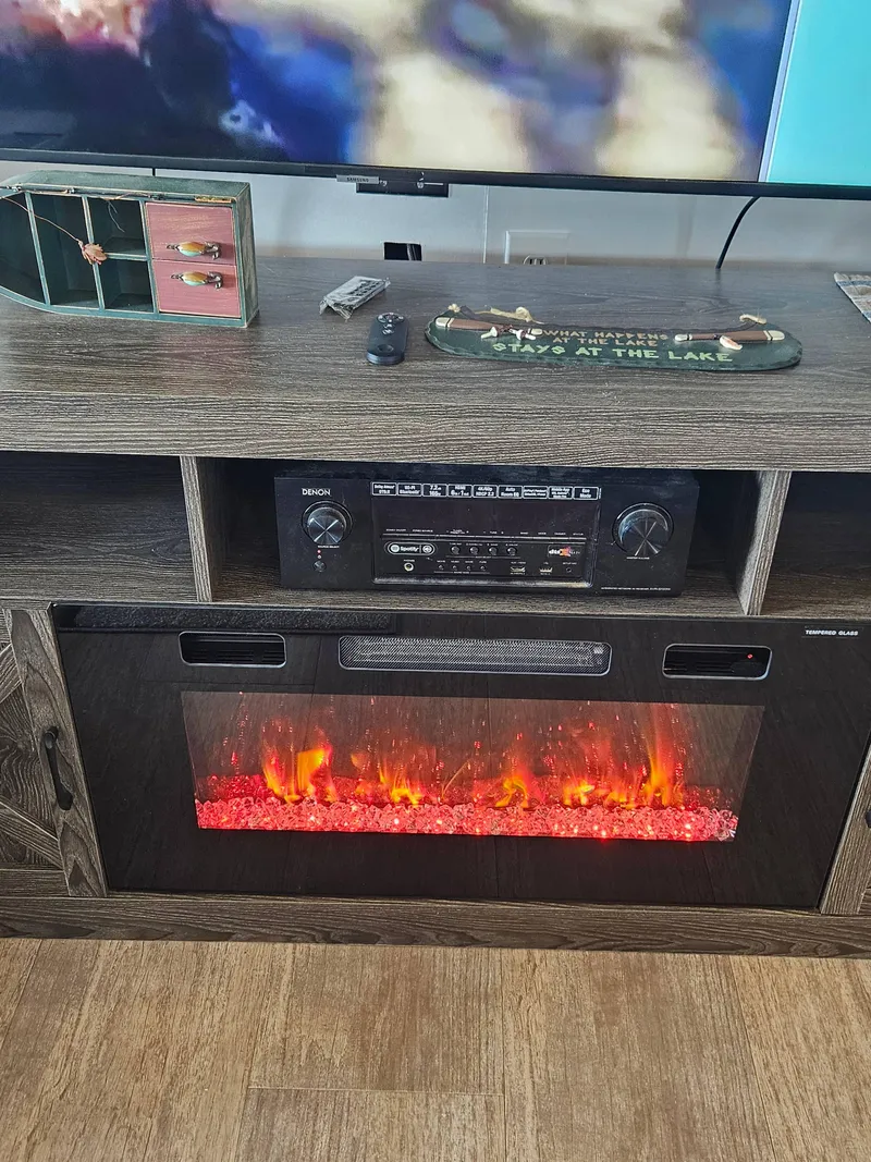 Slide: The Image of Entertainment center with electric fireplace on a 1997 SUMERSET HOUSEBOATS houseboat. - 4