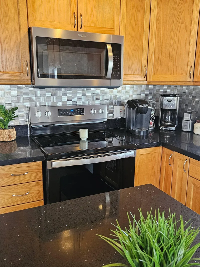 Slide: The Image of Modern kitchen in 1997 Sumerset Houseboat with stainless steel appliances and wooden cabinets. - 8