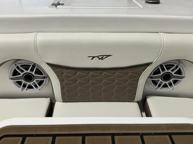 Slide: The Image of 2024 Tidewater 272 CC Adventure boat interior with speakers and stylish upholstery. - 20