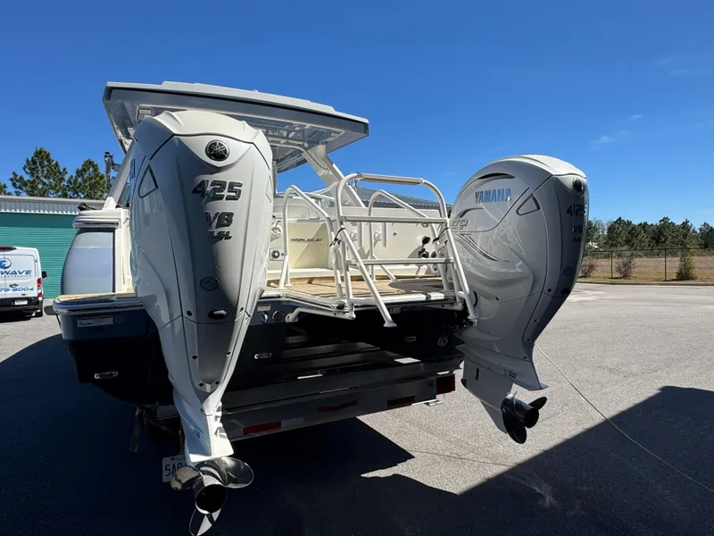 Slide: The Image of 2022 World Cat 400 DC-X boat with twin Yamaha 425 engines, parked outdoors. - 10