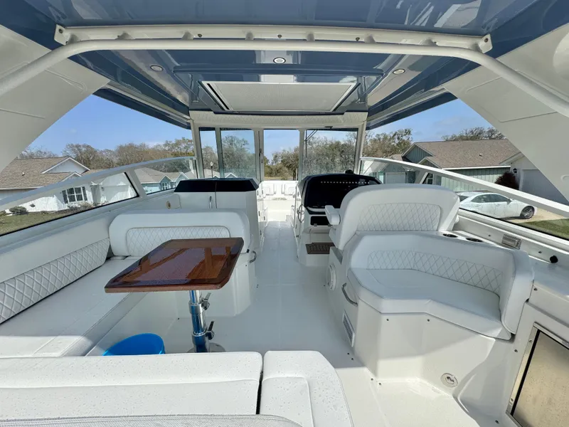 Slide: The Image of Luxurious interior of 2022 World Cat 400 DC-X boat with seating and table. - 18