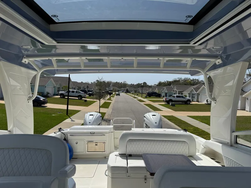 Slide: The Image of 2022 World Cat 400 DC-X boat interior with street view in background. - 19
