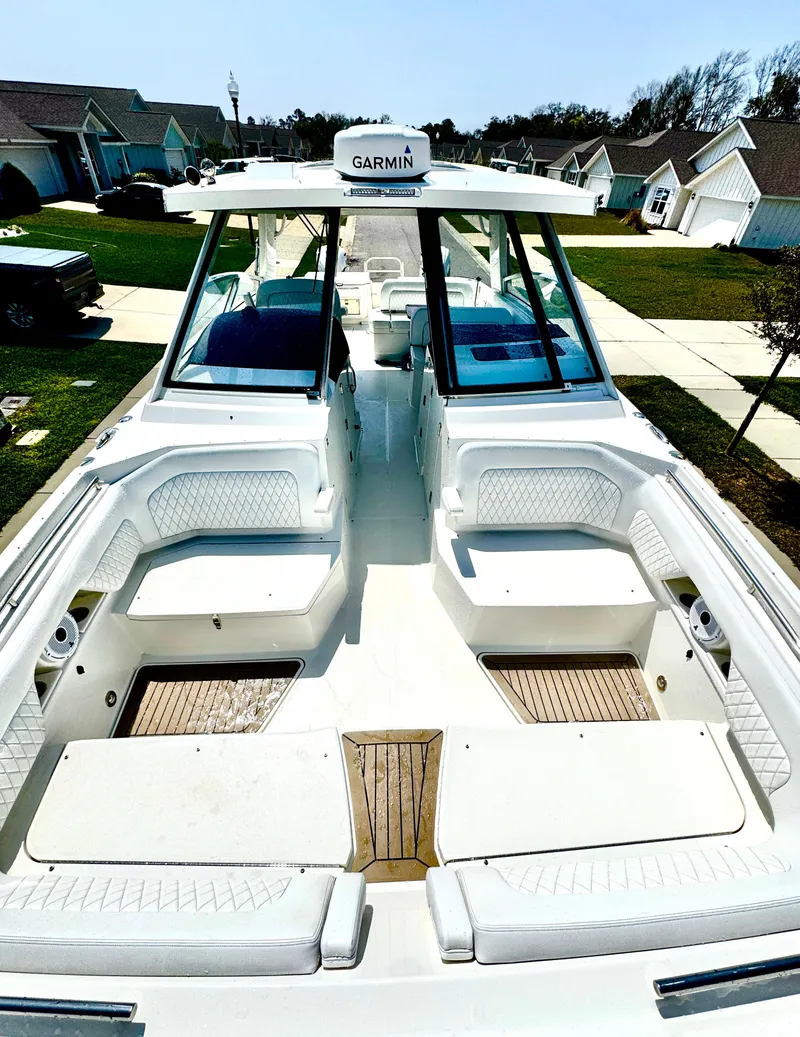 Slide: The Image of 2022 World Cat 400 DC-X boat with spacious seating and Garmin navigation system. - 20