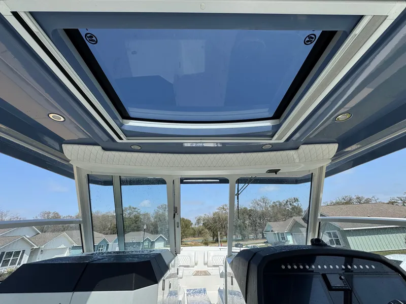 Slide: The Image of Interior view of 2022 World Cat 400 DC-X boat with sunroof and modern design. - 22