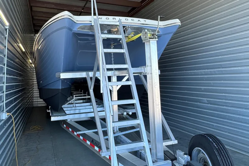 Slide: The Image of 2022 World Cat 400 DC-X boat on trailer in storage facility. - 23