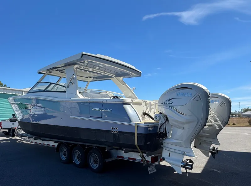 Slide: The Image of 2022 World Cat 400 DC-X boat with dual Yamaha engines on a trailer. - 8