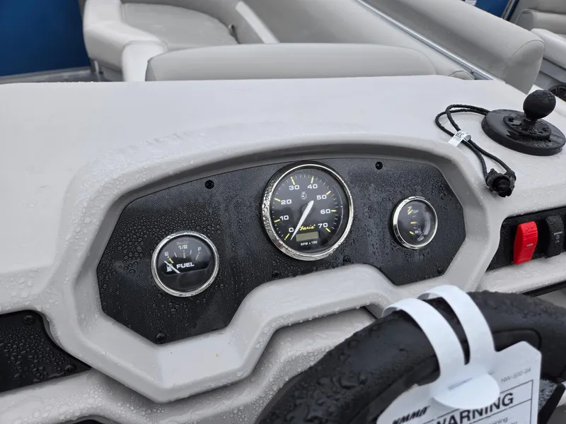 Slide: The Image of Dashboard of 2025 Godfrey Xperience 2286 SBX boat with gauges and controls. - 11