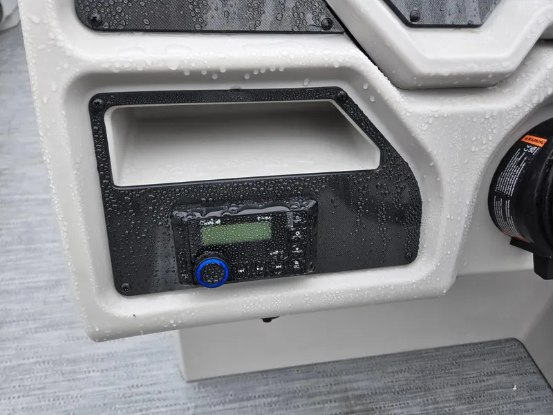 Slide: The Image of Control panel of 2025 Godfrey Xperience 2286 SBX boat, featuring a digital display. - 12