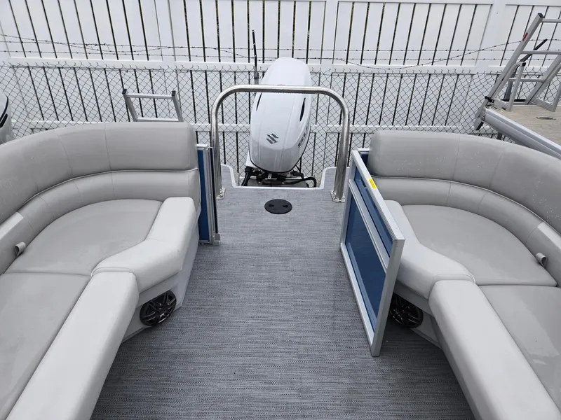 Slide: The Image of 2025 Godfrey Xperience 2286 SBX pontoon boat interior with gray seating and outboard motor. - 14