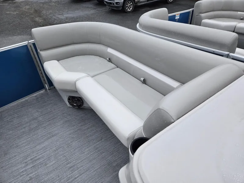 Slide: The Image of 2025 Godfrey Xperience 2286 SBX pontoon boat with gray seating and carpeted deck. - 27