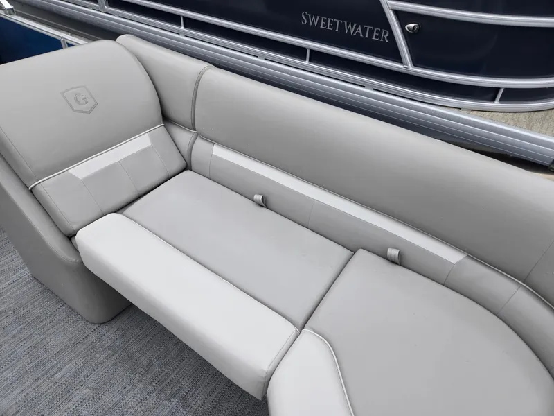 Slide: The Image of 2025 Godfrey Xperience 2286 SBX boat interior with sleek gray seating. - 6