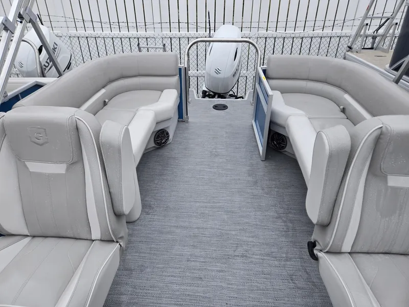 Slide: The Image of 2025 Godfrey Xperience 2286 SBX pontoon boat interior with gray seating and spacious layout. - 7