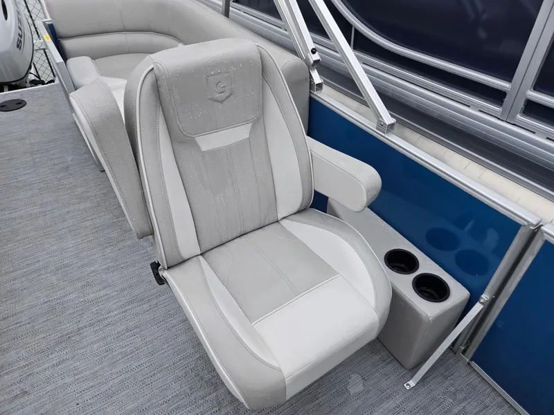 Slide: The Image of 2025 Godfrey Xperience 2286 SBX boat seat with cup holders, featuring gray upholstery. - 8