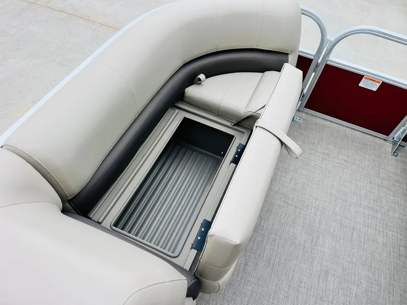 Slide: The Image of 2025 Sun Tracker Party Barge 18 DLX seating with storage compartment, beige upholstery. - 15
