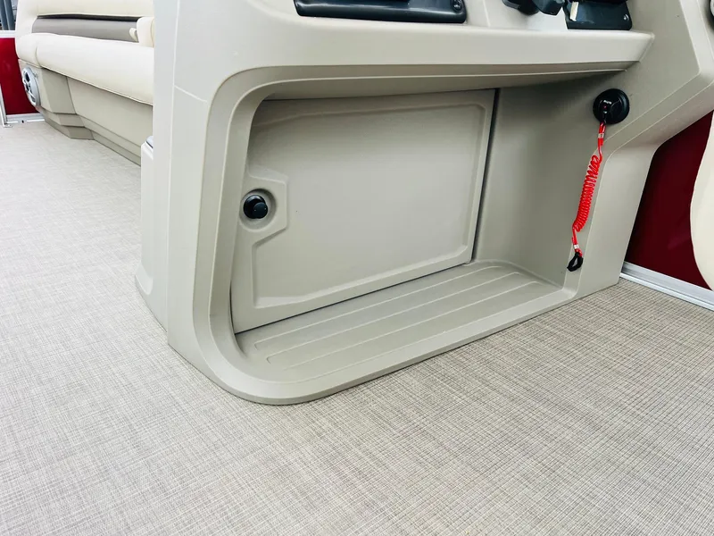 Slide: The Image of 2025 Sun Tracker Party Barge 18 DLX interior storage compartment with beige finish. - 37