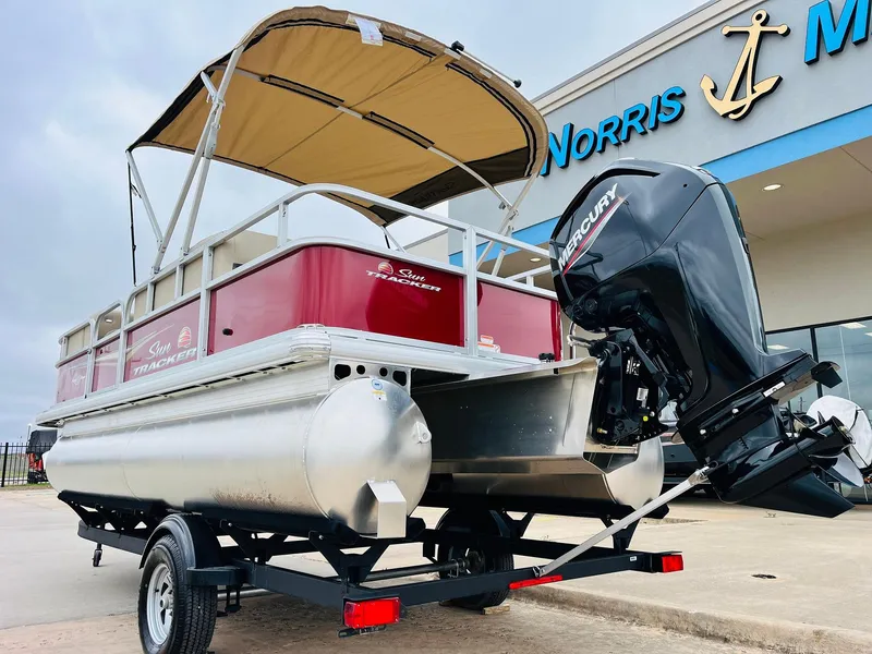 Slide: The Image of 2025 Sun Tracker Party Barge 18 DLX pontoon boat with Mercury outboard motor. - 9