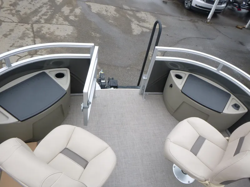 Slide: The Image of 2025 Sun Tracker Fishin' Barge 20 DLX interior with seating and storage compartments. - 16