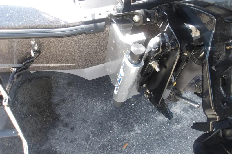 Slide: The Image of 2025 Ranger Z518 Cup-Equipped boat engine detail with hydraulic components. - 5