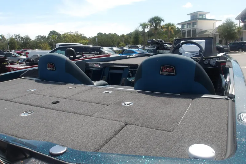 Slide: The Image of 2025 Ranger Z518 Cup-Equipped boat interior with dual seats and control panel. - 9