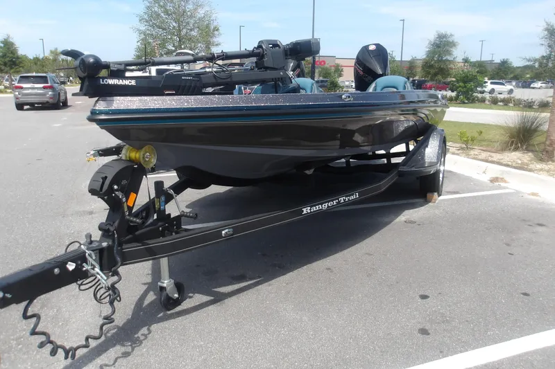 The Image of 2025 Ranger Z518 Cup-Equipped boat on trailer in parking lot. - 1