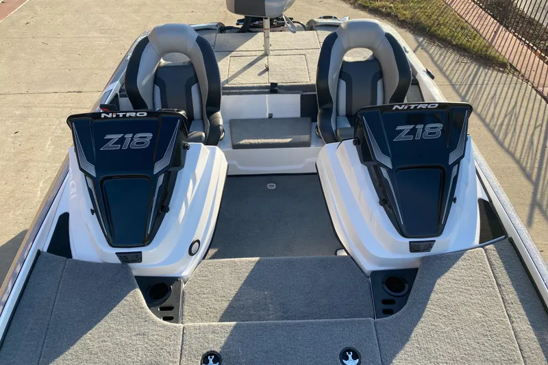 Slide: The Image of 2025 Nitro Z18 boat interior with dual seats and sleek design. - 4