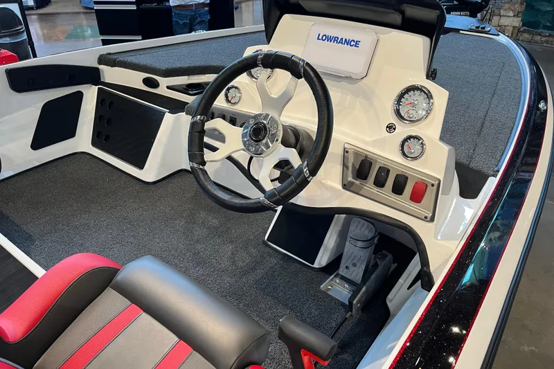 Slide: The Image of 2025 Nitro Z19 boat cockpit with steering wheel, gauges, and Lowrance display. - 3