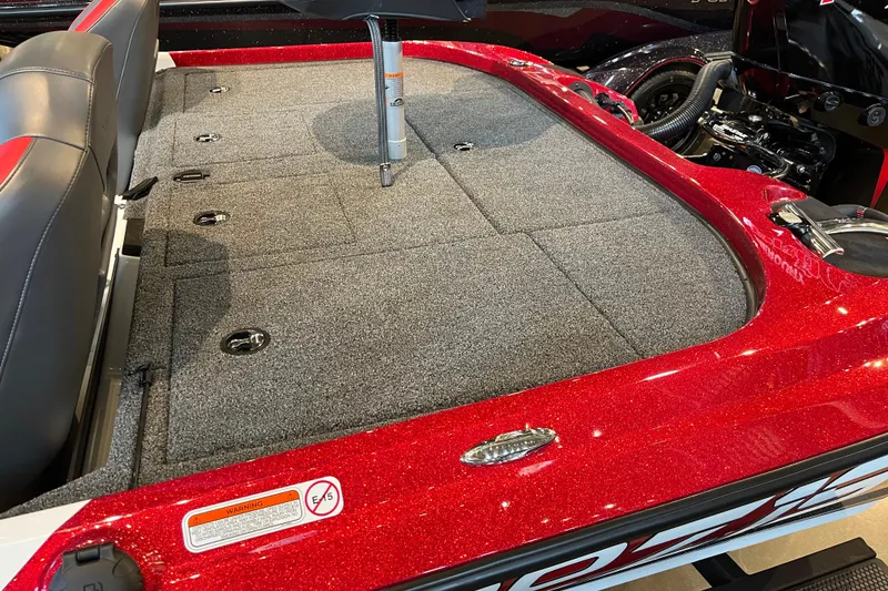 Slide: The Image of 2025 Nitro Z19 boat interior with red accents and carpeted deck. - 5