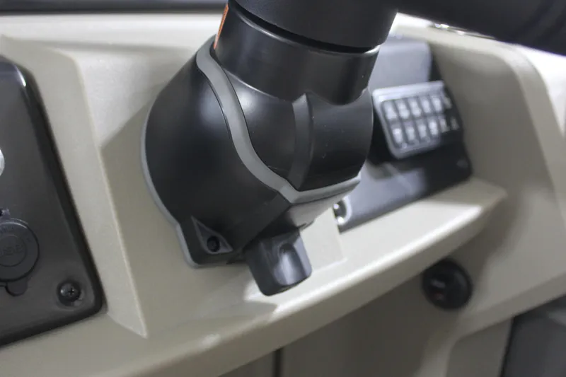 Slide: The Image of 2025 Sun Tracker Party Barge 20 DLX dashboard controls close-up. - 12