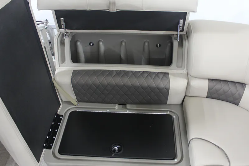 Slide: The Image of 2025 Sun Tracker Party Barge 20 DLX storage compartment with quilted upholstery. - 18