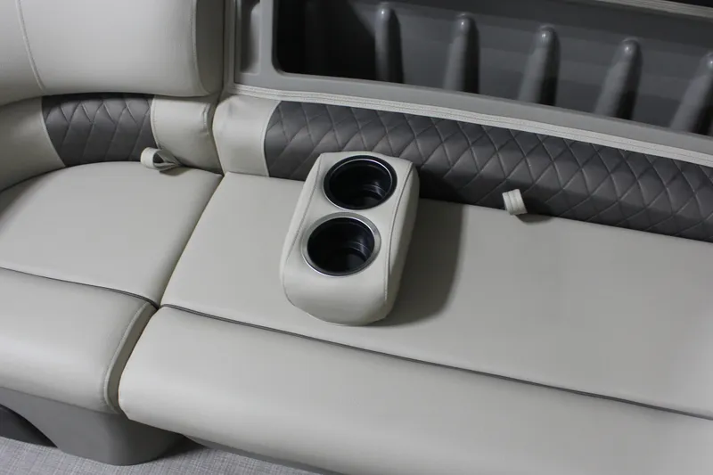 Slide: The Image of 2025 Sun Tracker Party Barge 20 DLX interior with cup holders and quilted upholstery. - 21