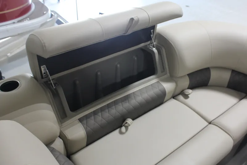 Slide: The Image of 2025 Sun Tracker Party Barge 20 DLX storage compartment with cushioned seating. - 7