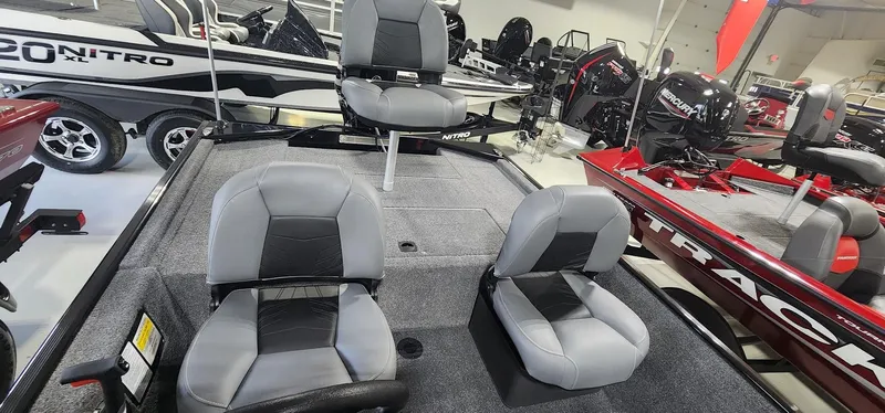 Slide: The Image of 2025 Tracker Bass Tracker Classic XL boat interior with gray seating and fishing deck. - 11