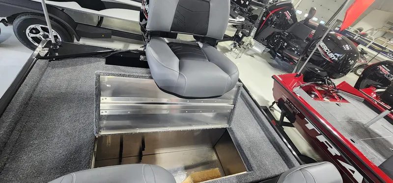 Slide: The Image of 2025 Tracker Bass Tracker Classic XL boat interior with storage compartment and seating. - 12