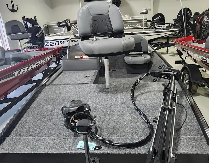 Slide: The Image of 2025 Tracker Bass Tracker Classic XL boat interior with seating and equipment. - 6