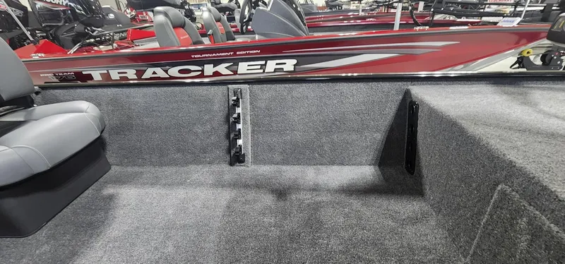 Slide: The Image of 2025 Tracker Bass Tracker Classic XL interior with gray seating and carpeted flooring. - 7