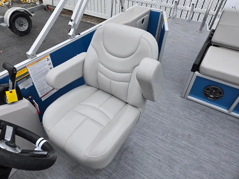 Slide: The Image of 2025 Godfrey Xperience 2286 SFLX boat seat with plush gray upholstery and armrests. - 10