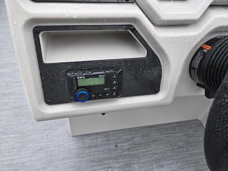 Slide: The Image of Control panel of 2025 Godfrey Xperience 2286 SFLX boat, featuring a digital display. - 13