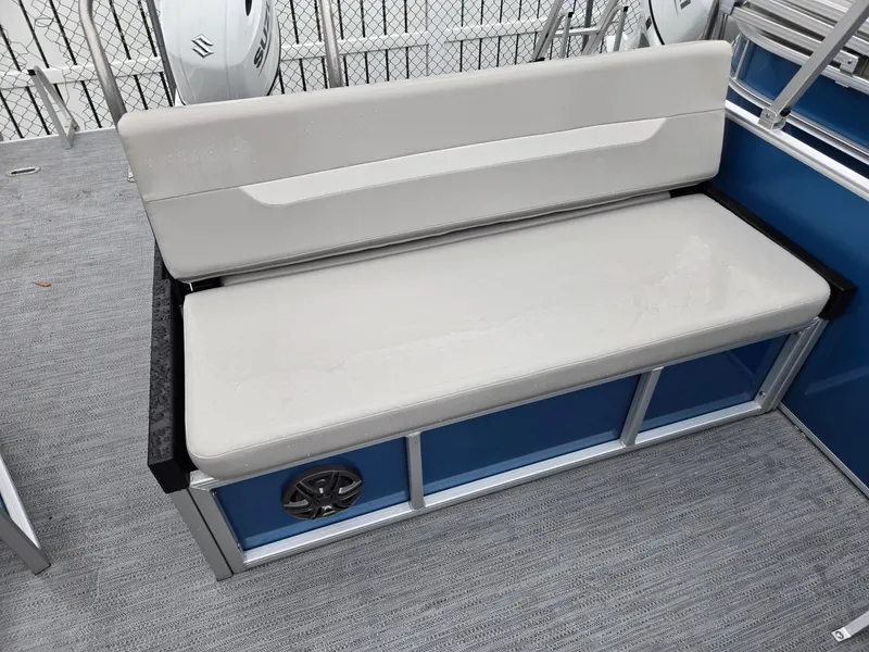 Slide: The Image of 2025 Godfrey Xperience 2286 SFLX boat seat with speaker, gray upholstery, and blue paneling. - 16