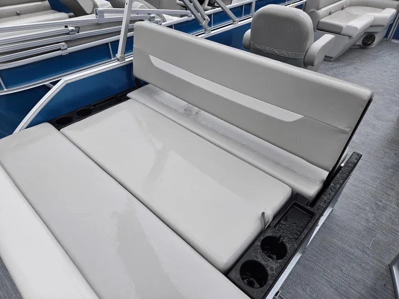Slide: The Image of 2025 Godfrey Xperience 2286 SFLX boat interior with gray seating and cup holders. - 21