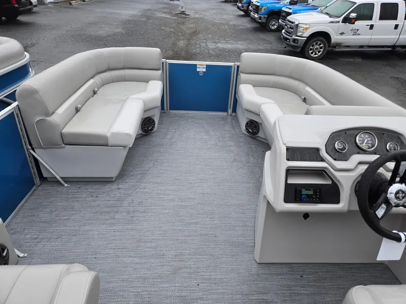Slide: The Image of 2025 Godfrey Xperience 2286 SFLX pontoon boat interior with plush seating and modern dashboard. - 24