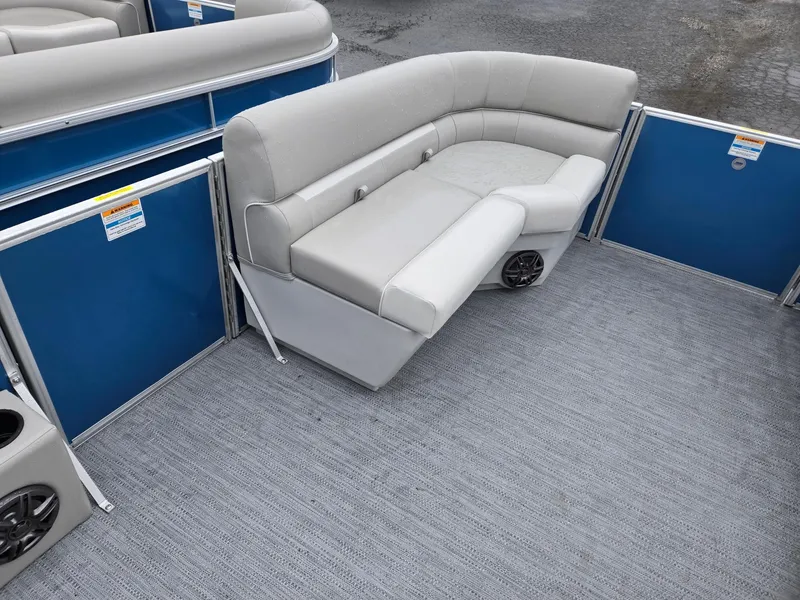 Slide: The Image of 2025 Godfrey Xperience 2286 SFLX pontoon boat with gray seating and blue paneling. - 25