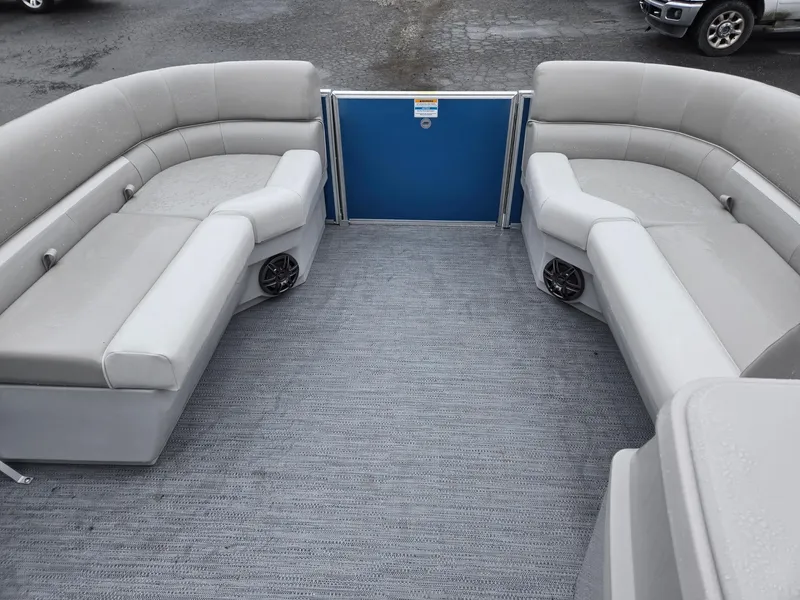 Slide: The Image of 2025 Godfrey Xperience 2286 SFLX pontoon boat interior with gray seating and carpet flooring. - 26
