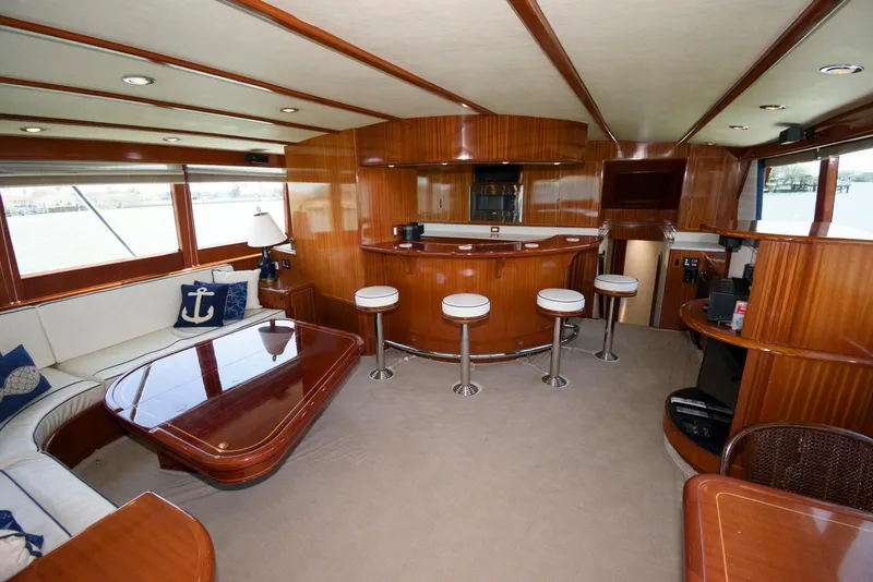 Slide: The Image of Luxurious interior of 1998 Huckins 70 Sportfish Convertible yacht with elegant wood finishes. - 33