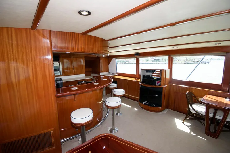 Slide: The Image of Luxurious interior of 1998 Huckins 70 Sportfish Convertible yacht with elegant wood finishes. - 35