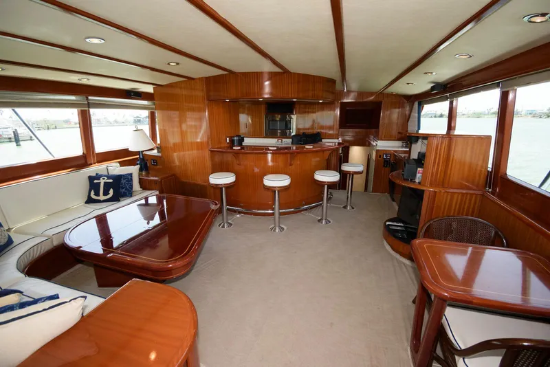 Slide: The Image of Luxurious interior of a 1998 Huckins 70 Sportfish Convertible yacht with elegant wood finishes. - 40