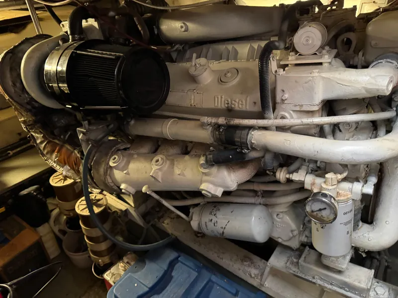 Slide: The Image of Engine of 1984 Hatteras 46 Convertible boat, showcasing diesel components and intricate machinery. - 29